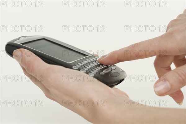 Woman holding a smart phone.