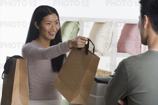 Female sales person assisting customer.