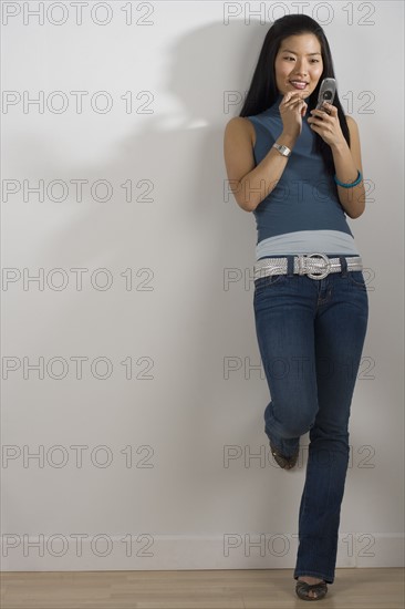 Young woman using a mobile phone.