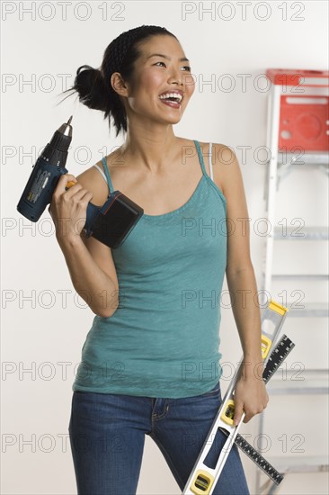 Woman doing home repairs.