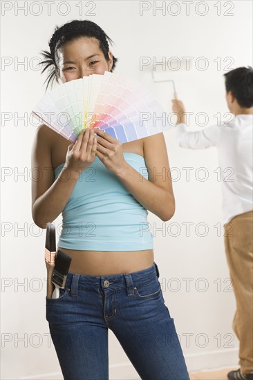 Portrait of woman with color samples.