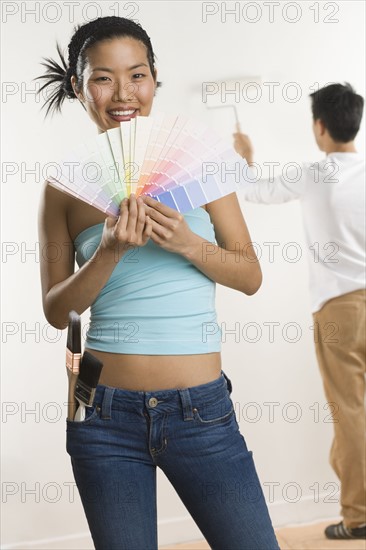 Portrait of woman with color samples.