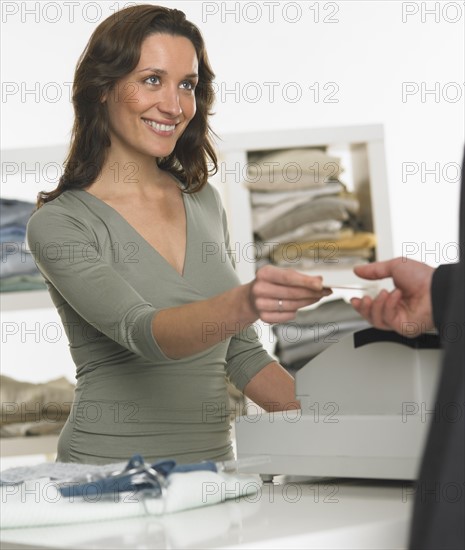 Female salesperson assisting male customer.