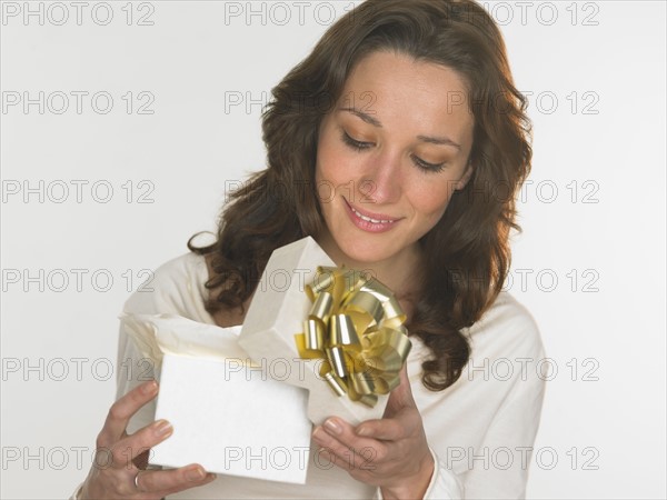 Woman opening gift box.