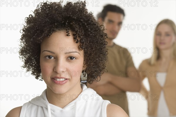 Portrait of young woman with two friends.