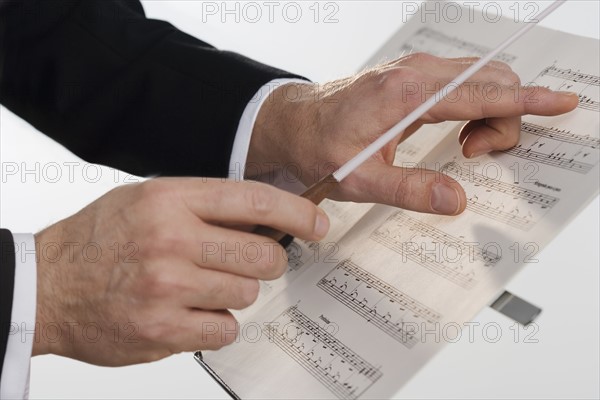 The hands of an orchestra conductor.