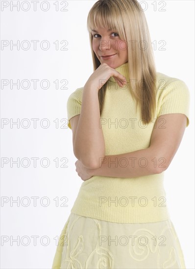 Studio shot of woman smiling.