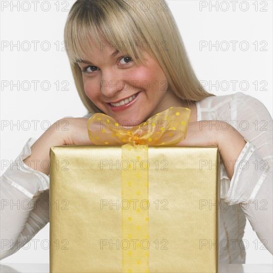 Studio shot of woman with gift.