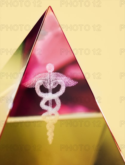 Close up of pyramid with Caduceus symbol in it.