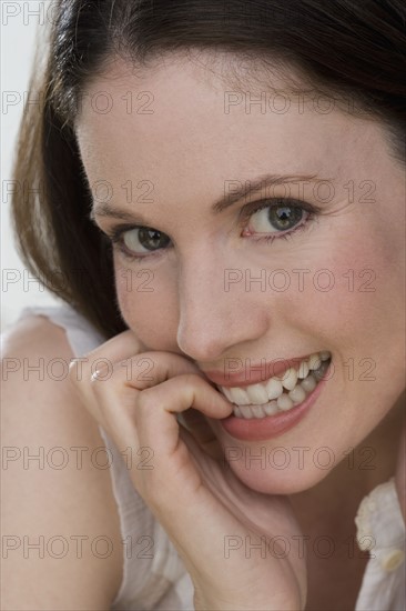 Close up of woman smiling.