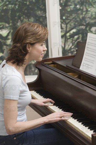 Woman playing piano.