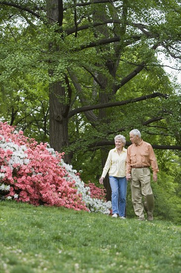 Senior couple walking outdoors.