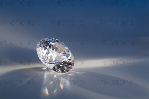 Closeup of a sparkly clear faceted gem.