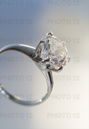 Diamond like ring in six pronged silver setting.
