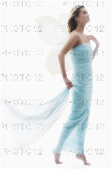 Young woman in full length gown.