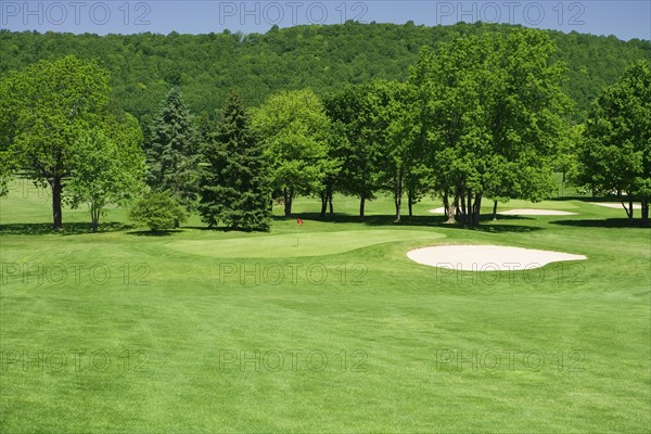 Golf course with sand trap.