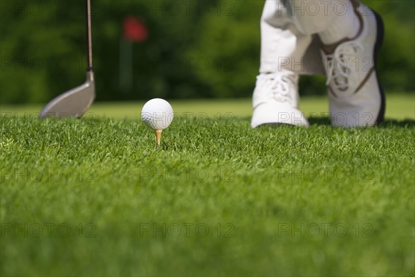 Golfer preparing to tee off.