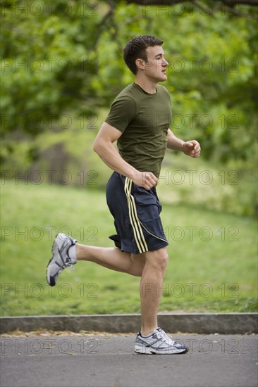 Man jogging in park.