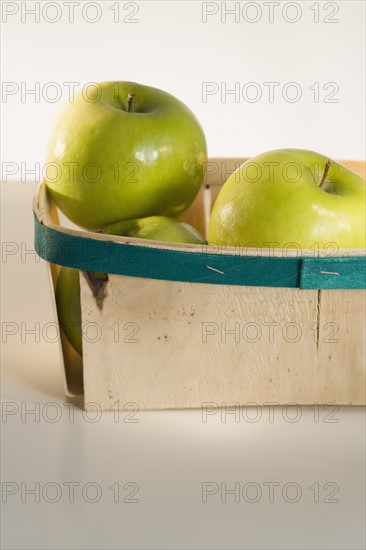 Close up of apples in basket.