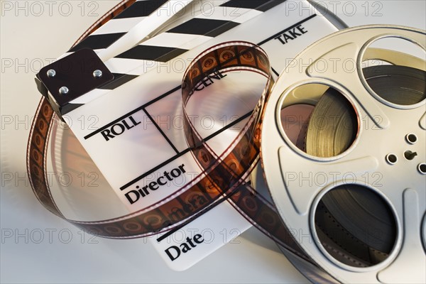 Movie reel with film and clapboard.