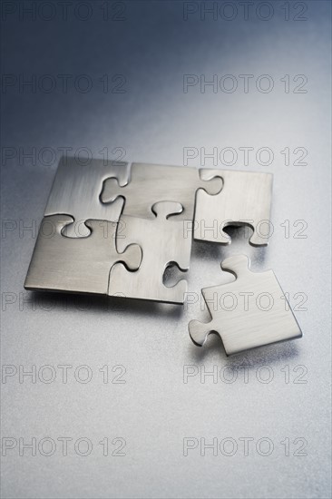 Metallic jigsaw puzzle.