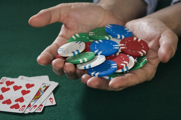 Man with winning poker hand.