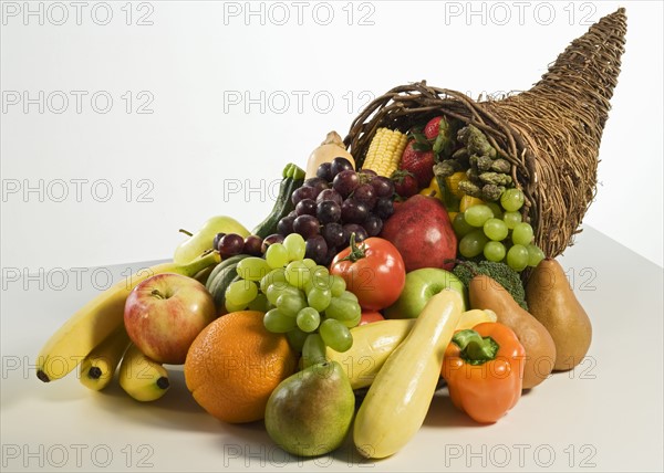 Fruits and vegetables in cornucopia basket.