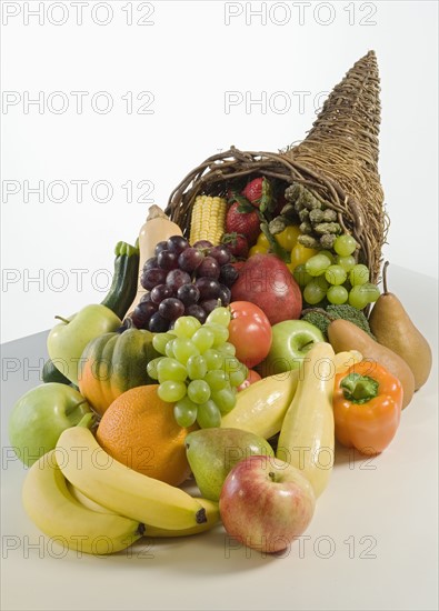 Fruits and vegetables in cornucopia basket.