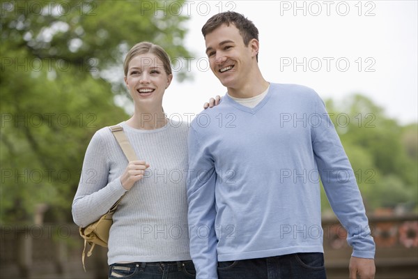 Portrait of young couple outdoors.