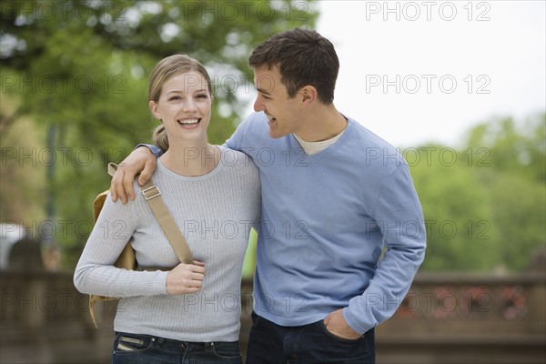 Portrait of young couple outdoors.