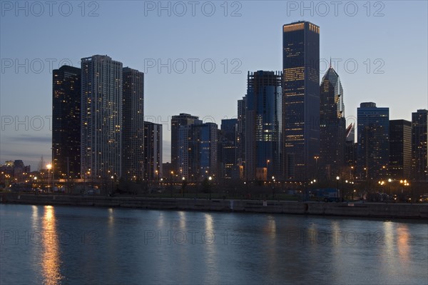 Skyline at night with Lake Michigan Chicago Illinois USA.