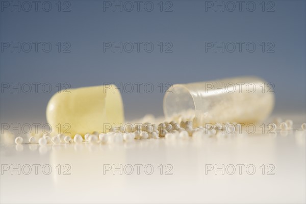 Close up of pill with contents spilled out.