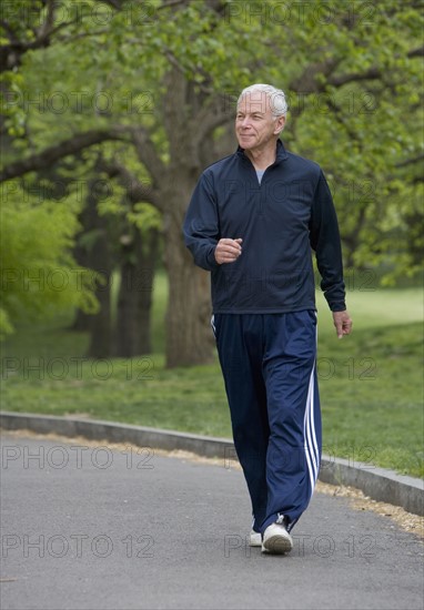 Senior man power walking.