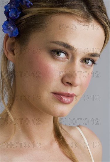 Young woman wearing a hair ornament.