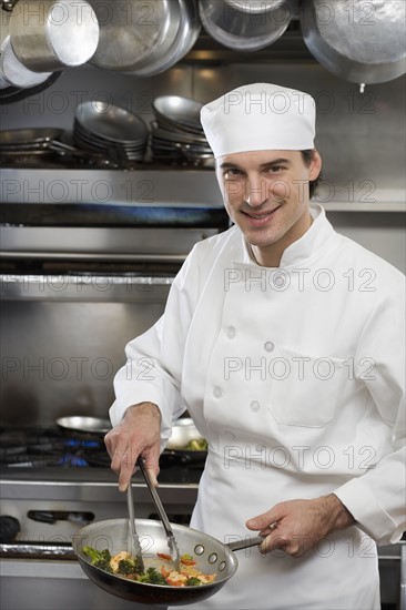 Male chef in restaurant kitchen.