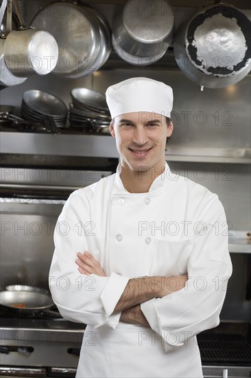 Male chef in restaurant kitchen.