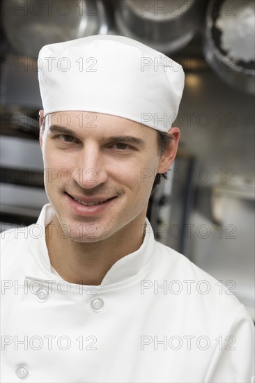 Male chef in restaurant kitchen.