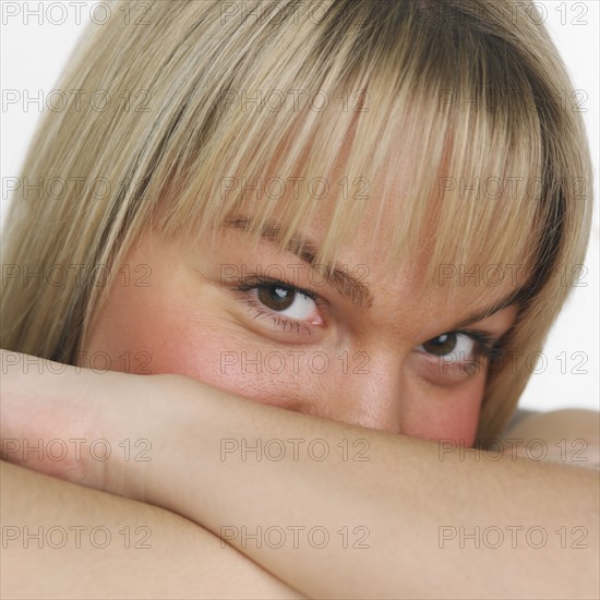 Studio shot of woman smiling.