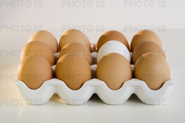 Close up of a dozen eggs.