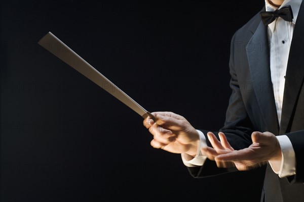 The hands of an orchestra conductor.