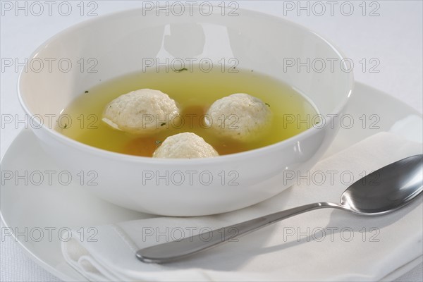 Close up of Matzah ball soup.