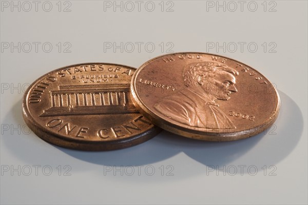 Close up of two pennies.