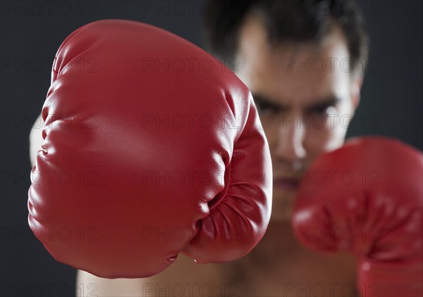 A boxer throwing punches.