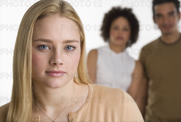 Portrait of young woman with two friends.