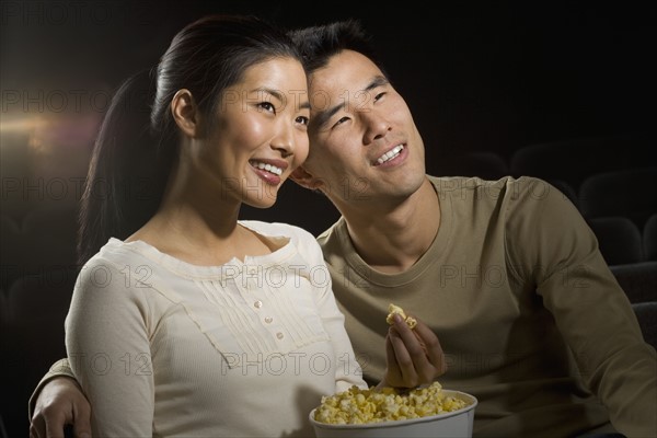 Couple watching a movie.