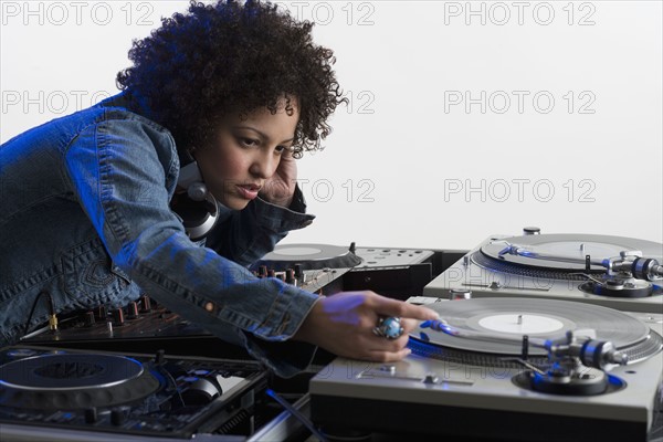 Woman working at a mixing board.