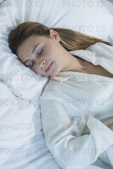 Woman sleeping in bed.