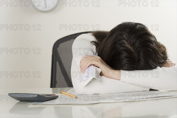 Woman working on paperwork.