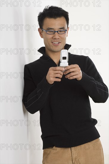 Young man using a mobile phone.