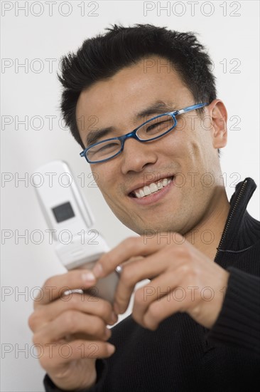 Young man using a mobile phone.